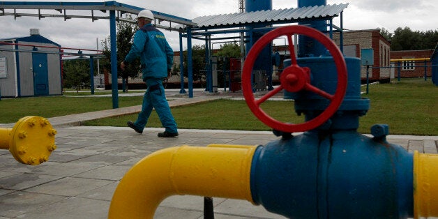 A worker at a boosting compressor station ''East-Poltava'' near the village of Kovalivka, Poltava region some 357 kilometers of Kiev, Ukraine, Friday, June 27, 2014. Russia's state-controlled gas company, Gazprom, warned its European customers Friday that it could limit supplies to those European countries that intend to re-sell the natural gas on to Ukraine. (AP Photo/Sergei Chuzavkov)