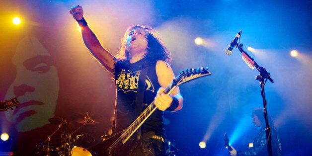 MANCHESTER, UNITED KINGDOM - DECEMBER 19: Mille Petrozza of Kreator performs on stage at Manchester Academy on December 19, 2014 in Manchester, United Kingdom. (Photo by Gary Wolstenholme/Redferns via Getty Images)