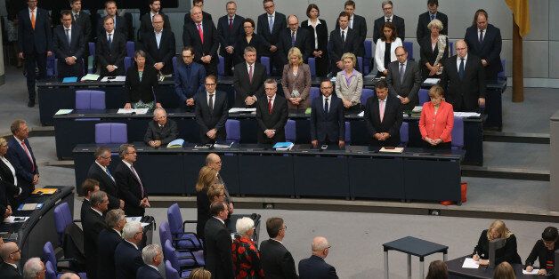 BERLIN, GERMANY - JULY 17: Members of the German government and parliament, the Bundestag, stand to mourn recently-deceased CDU politician Philipp Missfelder prior to debates and votes over the third EU financial aid package to Greece at an extraordinary session of the German parliament, the Bundestag, on July 17, 2015 in Berlin, Germany. Missfelder died unexpectdely recently of a pulmonary embolism at the age of 35. (Photo by Sean Gallup/Getty Images)