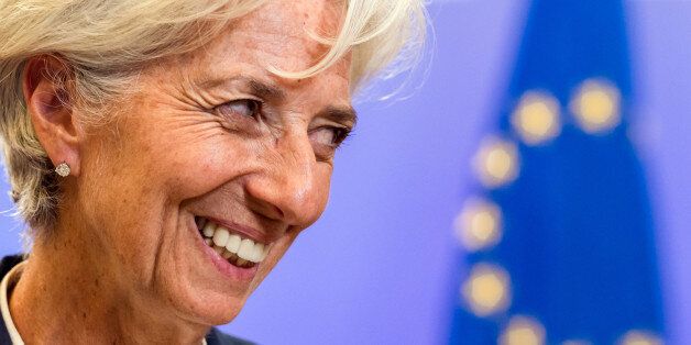 Managing Director of the International Monetary Fund Christine Lagarde smiles as she leaves after a meeting of eurozone heads of state at the EU Council building in Brussels on Monday, July 13, 2015. A summit of eurozone leaders reached a tentative agreement with Greece on Monday for a bailout program that includes