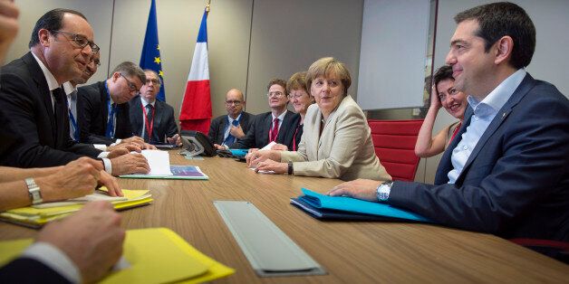 BRUSSEL, BELGIUM - JUNE 26: In this photo provided by the German Government Press Office (BPA), German Chancellor Angela Merkel, French President Francois Hollande (L) and Greek Prime Minister Alexis Tsipras (R) attend a meeting at the beginning of the second day of the European Summit on June 26, 2015 in Brussel, Belgium. (Photo by Guido Bergmann/Bundesregierung via Getty Images)