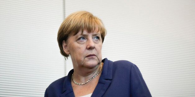 German Chancellor Angela Merkel arrives for a special meeting of the Christian Democratic Union (CDU) party faction on the eve of a special session of the parliament Bundestag about negotiations with Greece for a new bailout in Berlin, Germany, Thursday, July 16, 2015. (AP Photo/Markus Schreiber)