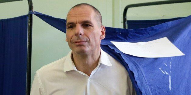 Greece's Finance Minister Yanis Varoufakis casts his vote at a polling station in Athens, Sunday, July 5, 2015. Greeks were voting Sunday in a bailout referendum that will decide the country's future, with opinion polls showing people evenly split on whether to accept creditors' proposals for more austerity in exchange for rescue loans or defiantly reject the deal. (AP Photo/Petr David Josek)