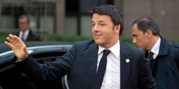 Italian Prime Minister Matteo Renzi, center, arrives for an EU summit at the European Council building in Brussels on Monday, June 22, 2015. Heads of state in the eurogroup meet in Brussels Monday for a special summit to discuss the financial crisis with Greece. (AP Photo/Michel Euler)