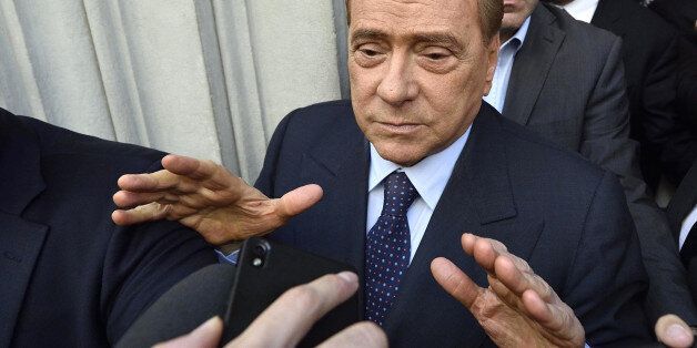 In this May 2, 2015 file photo, former Italian premier and AC Milan president Silvio Berlusconi meets the journalists in Milan, Italy. Silvio Berlusconi is reportedly close to selling a 48-percent stake in AC Milan to a Thai investor Friday, June 5, 2015: the Gazzetta dello Sport reports that the deal with Bee Taechaubol would be worth 470 million euros ($530 million). (Flavio Lo Scalzo/Ansa via AP)
