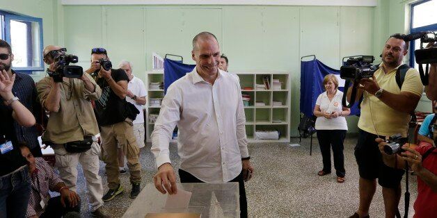Greece's Finance Minister Yanis Varoufakis cast his vote at a polling station in Athens, Sunday, July 5, 2015. Greeks were voting Sunday in a bailout referendum that will decide the country's future, with opinion polls showing people evenly split on whether to accept creditors' proposals for more austerity in exchange for rescue loans or defiantly reject the deal. (AP Photo/Petr David Josek)