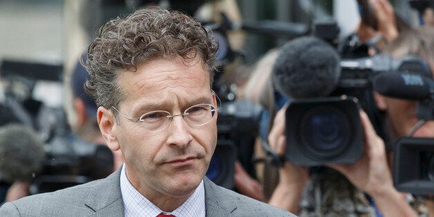Dutch Finance Minister and chair of the eurogroup Jeroen Dijsselbloem, walks past the media after a meeting of eurozone finance ministers at the EU LEX building in Brussels on Tuesday, July 7, 2015. Greek Prime Minister Alexis Tsipras was heading Tuesday to Brussels for an emergency meeting of eurozone leaders, where he will try to use a resounding referendum victory to eke out concessions from European creditors over a bailout for the crisis-ridden country. (AP Photo/Michel Euler)