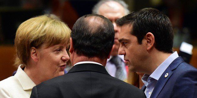 (From L) German Chancellor Angela Merkel, French President Francois Hollande, and Greek Prime Minister Alexis Tsipras confer prior to the start of a summit of Eurozone heads of state in Brussels on July 12, 2015. The EU cancelled a full 28-nation summit to decide whether Greece stays in the European single currency as a divided eurozone struggled to reach a reform-for-bailout deal. AFP PHOTO / JOHN MACDOUGALL (Photo credit should read JOHN MACDOUGALL/AFP/Getty Images)