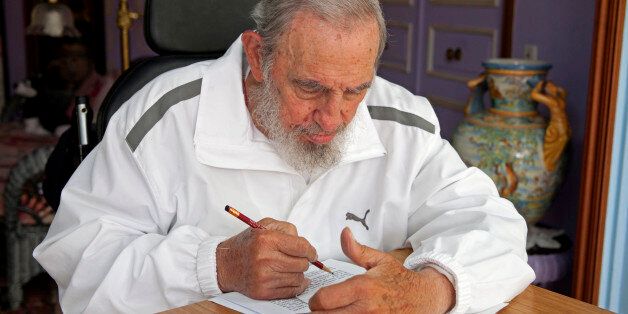 Cuba's leader Fidel Castro prepares his vote for municipal elections at his house in Havana, Cuba, Sunday, April 19, 2015. Cuba held its first local elections, which allow direct voting for delegates to municipal assemblies that deal with local issues, since a historic thaw in relations with the United States with an unusual wrinkle in the single-party system: two of the 27,000 candidates openly oppose the government.(AP Photo/Alex Castro)