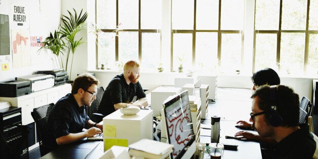 Businessmen and businesswoman working in startup office