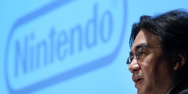 FILE PHOTO: Satoru Iwata, president of Nintendo Co., speaks during a news conference in Tokyo, Japan, on Thursday, Jan. 30, 2014. Iwata, who led the Japanese gamemaker back to ascendancy in the early 2000s with the Wii console, died July 11, 2015, from bile duct cancer, the Kyoto-based company said in a statement. Photographer: Tomohiro Ohsumi/Bloomberg via Getty Images