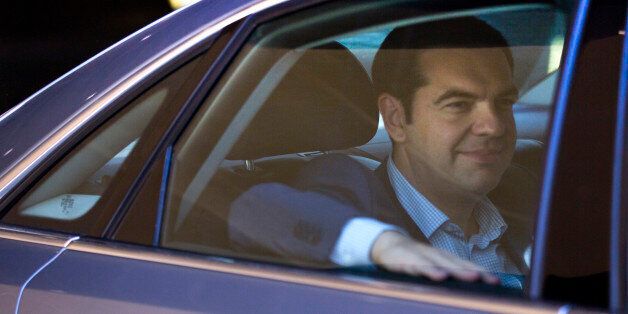 Greek Prime Minister Alexis Tsipras leaves in his car after a meeting at EU headquarters in Brussels on Wednesday, June 24, 2015. Eurozone finance ministers meet Wednesday to discuss the Greek bailout. (AP Photo/Virginia Mayo)