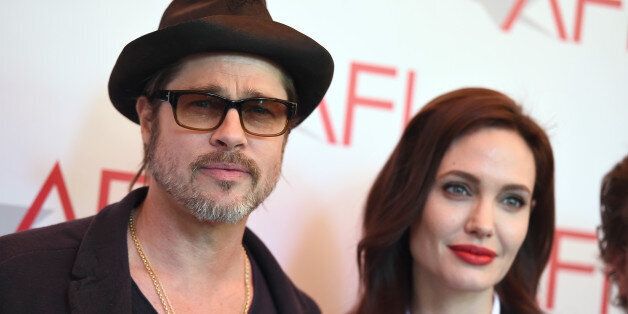 Brad Pitt, left, and Angelina Jolie arrive at the AFI Awards at The Four Seasons Hotel on Friday, Jan. 9, 2015 in Los Angeles. (Photo by Jordan Strauss/Invision/AP)
