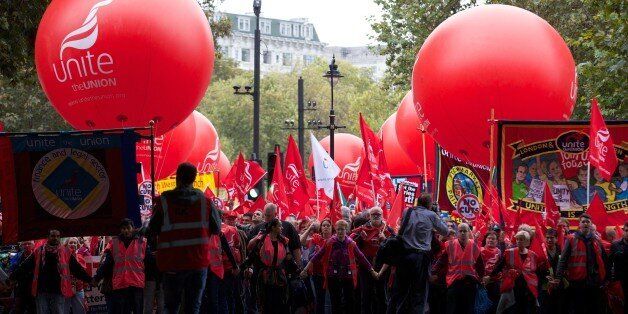 Thousands of people march in London on October 18, 2014, against falling real wages. The event is organised by The Trades Union Congress (TUC), a federation of the country's main trade unions. AFP PHOTO/ANDREW COWIE (Photo credit should read ANDREW COWIE/AFP/Getty Images)