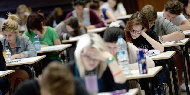 French students work on the test of philosophy as they take the baccalaureat exam (high school graduation exam) on June 16, 2014 at the Fustel de Coulanges high school in Strasbourg, eastern France. Some 686 907 candidates are registered for the 2014 session. AFP PHOTO/FREDERICK FLORIN (Photo credit should read FREDERICK FLORIN/AFP/Getty Images)