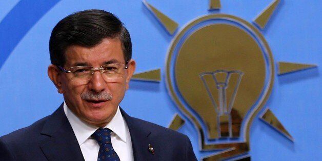Turkey's Prime Minister Ahmet Davutoglu speaks during a news conference at his ruling AK Party (AKP) headquarters in Ankara, Turkey, June 26, 2015. AFP PHOTO/ADEM ALTAN (Photo credit should read ADEM ALTAN/AFP/Getty Images)