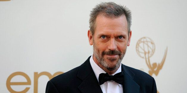 Hugh Laurie arrives at the 63rd Primetime Emmy Awards on Sunday, Sept. 18, 2011 in Los Angeles. (AP Photo/Chris Pizzello)