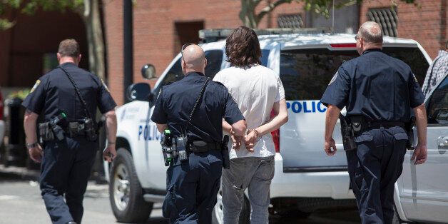 BOSTON, MA - JUNE 24: A man is taken into custody after a meat cleaver was found in his car in front of John Joseph Moakley United States Courthouse during the formal sentencing of Boston Marathon Bomber Dzhokar Tsarnaev on June 24, 2015 in Boston, Massachusetts. Dzhokar Tsarnaev was found guilty on all 30 counts related to his involvement in the 2013 bombing, which resulted in three deaths and over 250 injuries. (Photo by Scott Eisen/Getty Images)