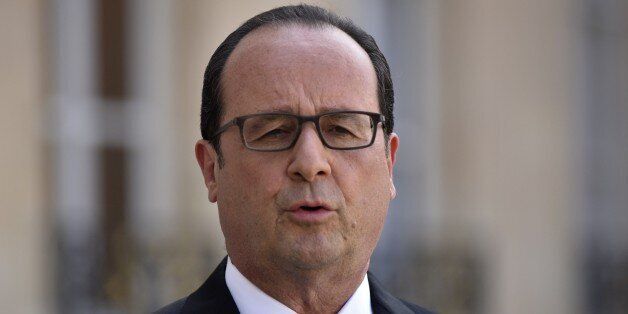 French President Francois Hollande delivers a speech after a high-level security meeting at the Elysee Palace on, Friday, June 26, 2015 in Paris, France. Hollande says he is raising the security alert to the highest level for three days in the southeastern region where a suspect attacked an American gas factory. (AP Photo/Zacharie Scheurer)