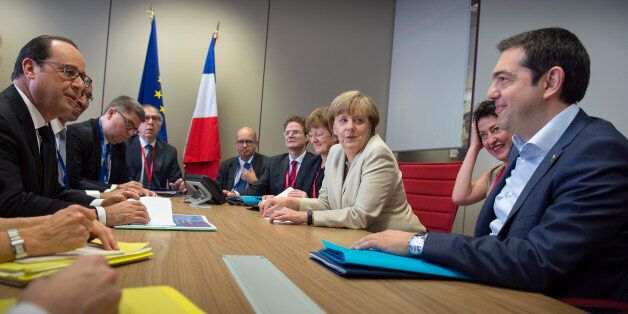 BRUSSEL, BELGIUM - JUNE 26: In this photo provided by the German Government Press Office (BPA), German Chancellor Angela Merkel, French President Francois Hollande (L) and Greek Prime Minister Alexis Tsipras (R) attend a meeting at the beginning of the second day of the European Summit on June 26, 2015 in Brussel, Belgium. (Photo by Guido Bergmann/Bundesregierung via Getty Images)