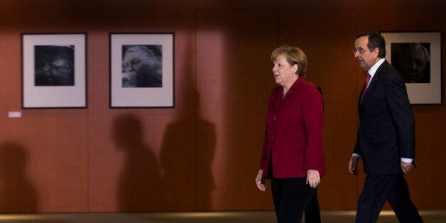 German Chancellor Angela Merkel, left, welcomes the Prime Minister of Greece, Antonis Samaras for a meeting at the chancellery in Berlin, Tuesday, Jan. 8, 2013. (AP Photo/Markus Schreiber)