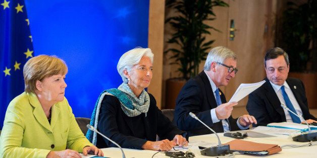 From left, German Chancellor Angela Merkel, Managing Director of the International Monetary Fund Christine Lagarde, European Commission President Jean-Claude Juncker and European Central Bank Governor Mario Draghi participate in a meeting at an EU summit at the European Council building in Brussels on Monday, June 22, 2015. Heads of state in the eurogroup meet in Brussels Monday for a special summit to discuss the financial crisis with Greece. (AP Photo/Geert Vanden Wijngaert)