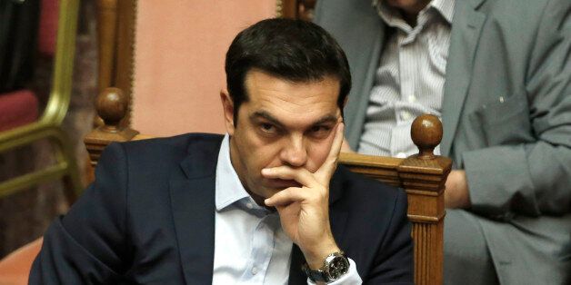 Greece's Prime Minister Alexis Tsipras attends an emergency Parliament session for the governmentâs proposed referendum in Athens, Saturday, June 27, 2015. After five months of fruitless negotiations, relations between Greece and its creditors crumbled further Saturday after Prime Minister Tsipras stunned them by calling for a referendum on the proposed reforms needed to get bailout loans. (AP Photo/Petros Karadjias)