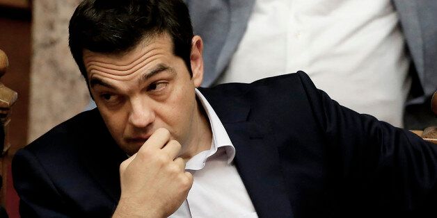 Greece's Prime Minister Alexis Tsipras attends an emergency Parliament session for the governmentâs proposed referendum in Athens, Saturday, June 27, 2015. Greece's place in the euro currency bloc looked increasingly shaky on Saturday, when eurozone countries rejected a monthlong extension to its bailout program and the prime minister called for a risky popular vote on the country's financial future. (AP Photo/Petros Karadjias)