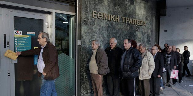 Pensioners wait to enter a National Bank branch to receive their pensions, which were deposited in the bank, on Thursday, Feb. 26, 2015. This is a monthly scene in Greece, where retirees have seen their pensions cut and have frequently run out of money by the time the next monthly installment is paid. Greece's prime minister Alexis Tsipras held a marathon meeting with his party's lawmakers Wednesday, briefing them on pledges made to European creditors to win a four-month extension of the country
