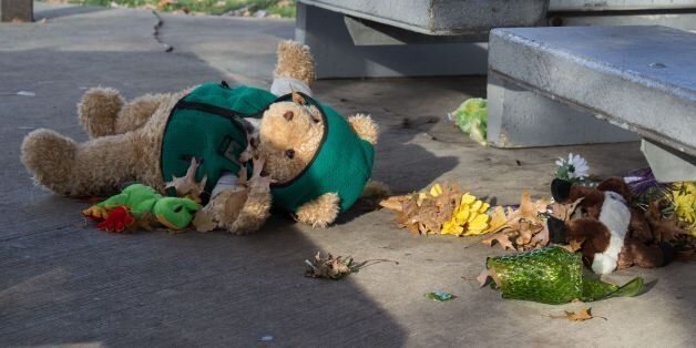 A stuffed animal lays on the ground at the Cudell Commons Park in Cleveland, Ohio, November 24, 2014 after extreme wind blew the teddy bear from a make-shift memorial for Tamir Rice, a 12-year-old boy shot by police on November 23. The chief of police in the US city of Cleveland on Monday defended the conduct of the officer who fatally shot the 12-year-old who was wielding a replica handgun. Tamir Rice died in hospital early Sunday after two police officers, responding to a 911 emergency call, confronted the African-American youngster at a recreation center. AFP PHOTO JORDAN GONZALEZ (Photo credit should read JORDAN GONZALEZ/AFP/Getty Images)