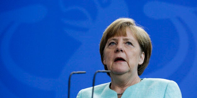 German Chancellor Angela Merkel attends a news conference with Prime Minister of Kosovo Isa Mustafa after bilateral talks at the chancellery in Berlin, Germany, Tuesday, June 30, 2015. (AP Photo/Markus Schreiber)