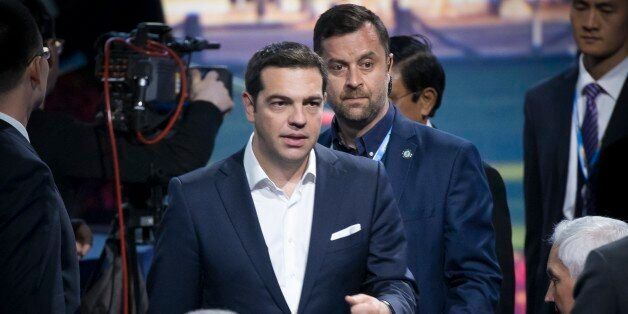 Greek Prime Minister Alexis Tsipras arrives at a plenary session of the St. Petersburg International Investment Forum in St.Petersburg, Russia, Friday, June 19, 2015. (AP Photo/Alexander Zemlianichenko)