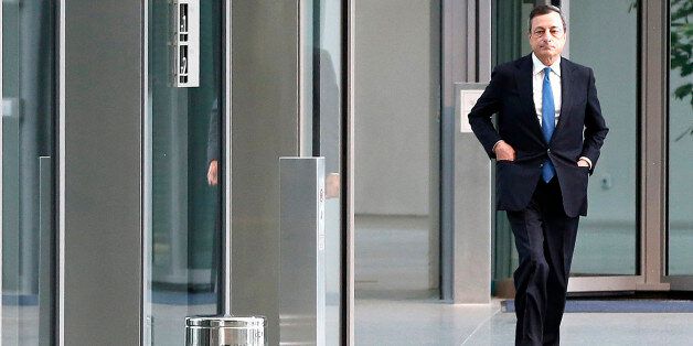 The president of the European Central Bank Mario Draghi, walks in the lobby of the ECB on his way to meet France's Prime Minister Manuel Valls in Frankfurt, Germany, Tuesday, June 23, 2015. (AP Photo/Michael Probst)