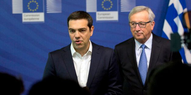 Greek Prime Minister Alexis Tsipras, left, and European Commission President Jean-Claude Juncker speak with the media prior to an EU summit at EU headquarters in Brussels on Monday, June 22, 2015. Heads of state in the eurogroup will meet in Brussels on Monday for a special summit to discuss the financial crisis with Greece. (AP Photo/Virginia Mayo)