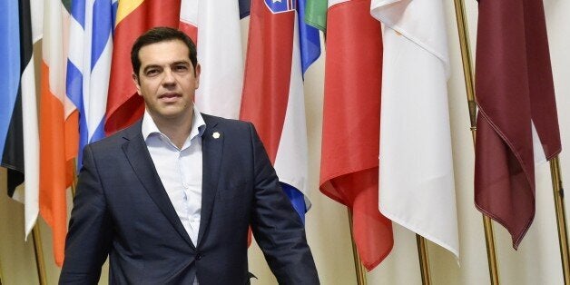 Greek Prime Minister Alexis Tsipras arrives to speak to journalists after an EU summit at the EU headquarters in Brussels on June 26, 2015. German Chancellor Angela Merkel urged Greece on Friday to accept an 'extraordinarily generous' offer from its EU-IMF creditors, which includes at least 12 billion euros ($13.4 billion) in further rescue cash over the next five months. Merkel and French President Francois Hollande asked Greek premier Alexis Tsipras to 'accept the extraordinarily generous offe