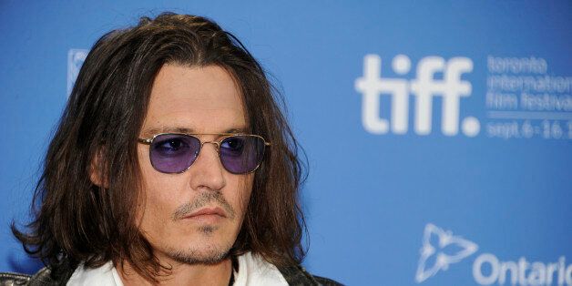 FILE - In this Sept. 8, 2012 file photo, actor Johnny Depp participates in a photo call and press conference for the film