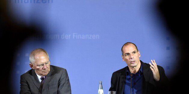 Greece's new Finance Minister Yanis Varoufakis (R) and his German counterpart Wolfgang Schaeuble (L) attend a joint press conference following their meeting on February 5, 2015 at the Finance ministry in Berlin. The new Greek finance minister's stop in Berlin follows a high-stakes visit to ECB headquarters in Frankfurt to try to drum up support for the new anti-austerity government's debt relief bid. AFP PHOTO / ODD ANDERSEN (Photo credit should read ODD ANDERSEN/AFP/Getty Images)