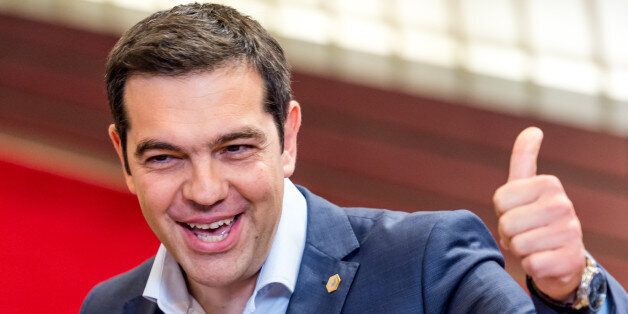 Greek Prime Minister Alexis Tsipras gestures as he leaves after an EU summit in Brussels on Friday, June 26, 2015. Greek prime minister sets referendum for July 5 on bailout deal with creditors. (AP Photo/Geert Vanden Wijngaert)