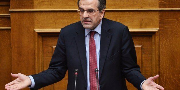 Greece main opposition party leader, Antonis Samaras speaks during a parliament session ahead of the confidence vote of the new government on February 10, 2015 in Athens. Greece's new leftist government fine-tuned a 10-point plan aimed at persuading its international creditors to reluctantly rethink their bailout terms and prevent the country from going bust. AFP PHOTO/ LOUISA GOULIAMAKI (Photo credit should read LOUISA GOULIAMAKI/AFP/Getty Images)