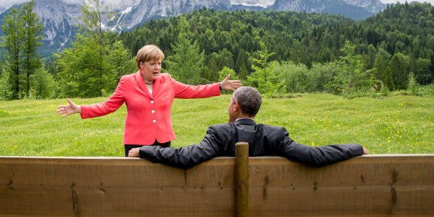 German chancellor Angela Merkel speaks with U.S. president Barack Obama at Schloss Elmau hotel near Garmisch-Partenkirchen, southern Germany, Monday June 8, 2015 during the G-7 summit. (Michaek Kappeler/Pool Photo via AP)