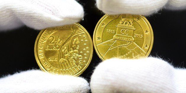 Commemorative coins to mark the 200th anniversary of The Battle of Waterloo are displayed during a ceremony held to unveil the 2.5-euro coin at the Royal Belgium Mint in Brussels on June 8, 2015. The coin, which exceptionally has a value of 2.5 euros after France objected Belgiums idea to issue a two-euro coin to mark the occasion of 200 years of the battle, bears the Lion's Mound and a diagram of the troops present in the battle. Ceremonies of the 200th anniversary are scheduled for 17-20 June. AFP PHOTO / EMMANUEL DUNAND (Photo credit should read EMMANUEL DUNAND/AFP/Getty Images)