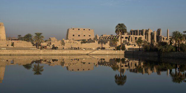 TO GO WITH AFP STORY BY SARAH BENHAIDAA picture taken on December 21, 2013, shows the Temple of Karnak, in the southern Egyptian city of Luxor. The 2011 revolution that toppled dictator Hosni Mubarak dealt a severe blow to the country's tourist industry, once a mainstay of Egypt's economy. AFP PHOTO / KHALED DESOUKI (Photo credit should read KHALED DESOUKI/AFP/Getty Images)