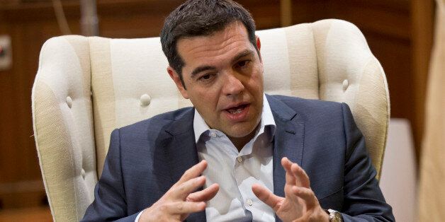 Greek Prime Minister Alexis Tsipras gestures during a meeting with Stavros Theodorakis, leader of the political party To Potami (The River) at his office in central Athens Tuesday, June 16, 2015. Greece insisted Monday it is ready to return to bailout talks