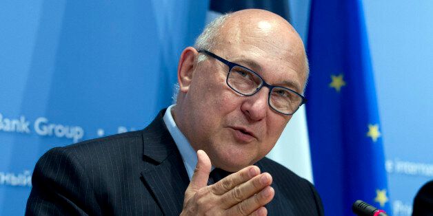 France's Finance Minister Michel Sapin speaks during a news conference after the IMFC meeting at the World Bank-International Monetary Fund annual meetings in Washington, Saturday, April 18, 2015. ( AP Photo/Jose Luis Magana)