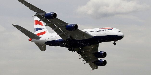 A British Airways Airbus A380 jet liner performs its demonstration flight during the 50th Paris Air Show at Le Bourget airport, north of Paris, Tuesday, June 18, 2013. (AP Photo/Francois Mori)