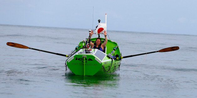 American rower Sonya Baumstein, from Orlando, Fla., waves as she leaves Choshi Marina in Choshi, a port east of Tokyo, headed for San Francisco Sunday, June 7, 2015. Baumstein hopes to finish the 9,600-kilometer (6,000-mile) journey by late September and become the first woman to row solo across the Pacific in the 23-foot (7-meter) -long vessel. (AP Photo/Shizuo Kambayashi)
