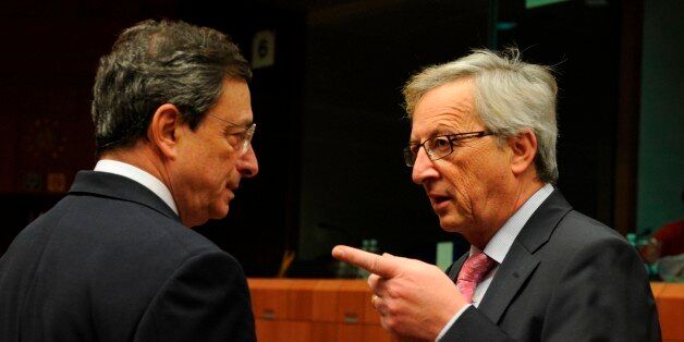 Luxemburg Prime minister and chairman of the Eurogroup Jean Claude Juncker (R) speaks with European Central Bank (ECB) chief Mario Draghi (L) on January 23, 2012 before an Eurogroup Council meeting at EU headquarters in Brussels. Eurozone finance ministers meet to fine-tune strategy to fight the debt crisis and to focus on difficult negotiations in Athens on so-called Private-Sector Involvement. AFP PHOTO / JOHN THYS (Photo credit should read JOHN THYS/AFP/Getty Images)