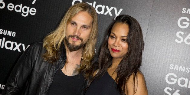 Marco Perego, left, and Zoe Saldana arrive at the Launch Of The Samsung Galaxy S6 And The Galaxy S6 Edge at Quixote Studios on Thursday, April 2, 2015, in West Hollywood, Calif. (Photo by Rich Fury/Invision/AP)