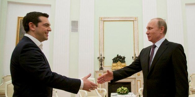 Russian President Vladimir Putin, right, welcomes visiting Greek Prime Minister Alexis Tsipras in Moscow's Kremlin, Russia, Wednesday, April 8, 2015. Alexis Tsipras is in Russia on an official visit. (AP Photo/Alexander Zemlianichenko, Pool)