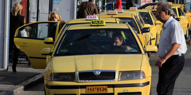 Taxis wait for passengers during a 24-hour strike by metro, bus, trolley, and tram workers in Athens, Tuesday, Oct. 25, 2011. Leaders of the 17-nation eurozone, fearing the financial crisis could spread from debt-shackled countries like Greece to larger economies, failed to clinch a comprehensive debt deal at a weekend summit. (AP Photo/Thanassis Stavrakis)